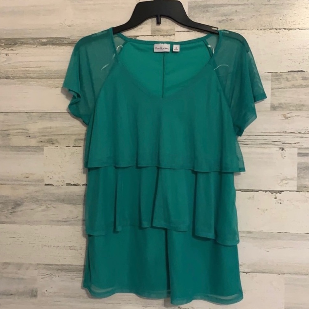 Kim Rogers Green Shirt